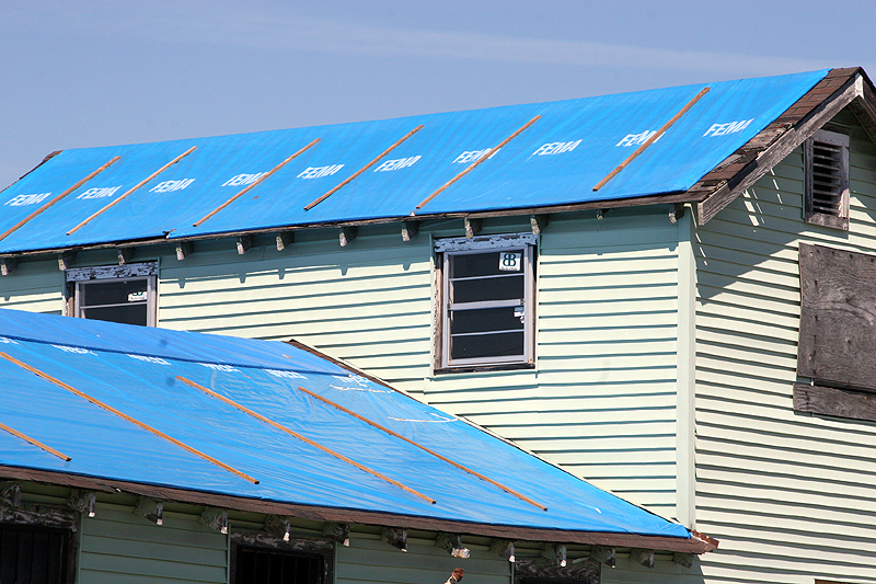 New Orleans, LA, February 27, 2006 - FEMA provided blue plastic sheeting  to temporarily protect roofs damaged by hurricane winds until the homeowner can repair or replace the damaged roof.  Some structures, still in need of repair, continue to rely on the blue roof covering well after the 30 day warranty period.  Robert Kaufmann/FEMA